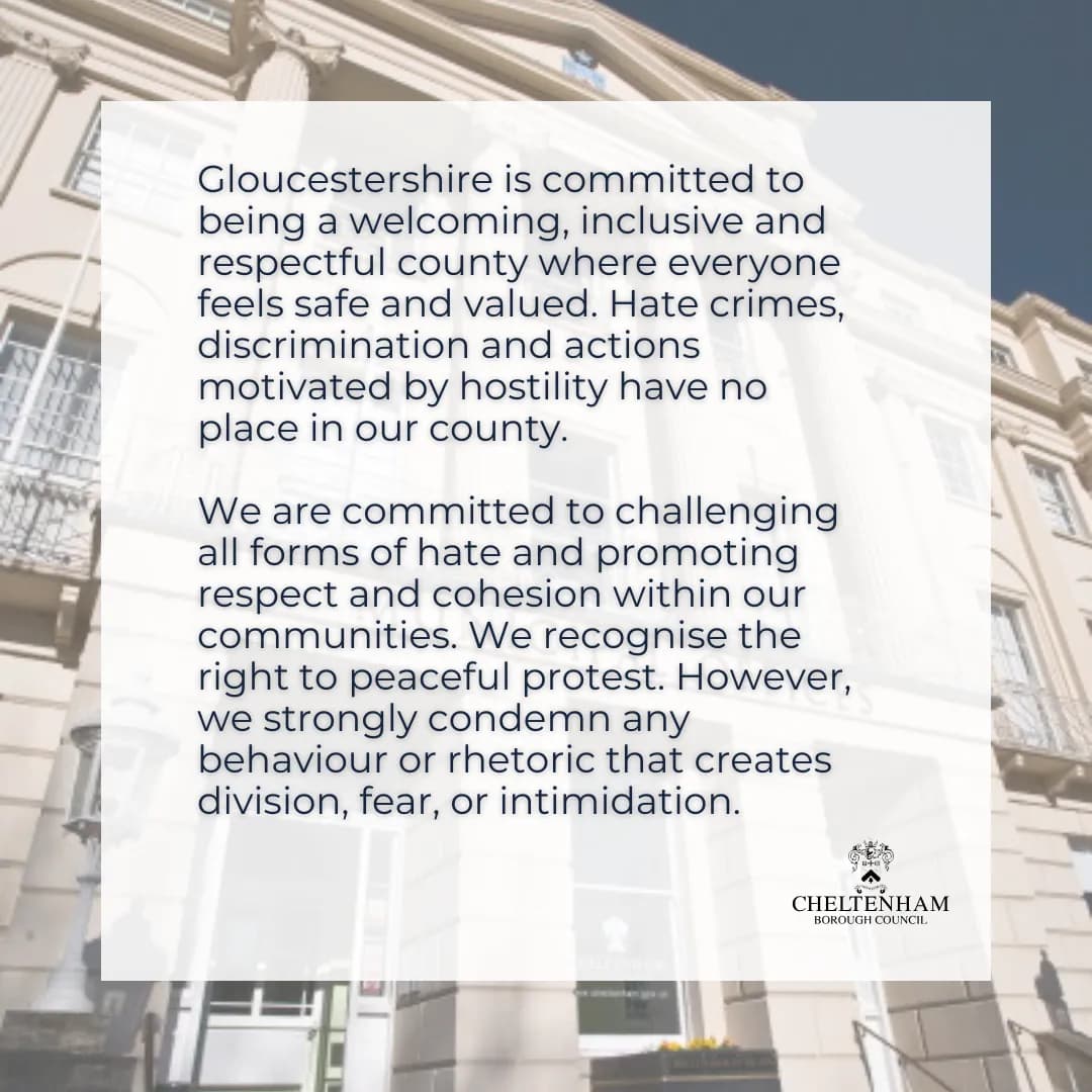 A white overlay containing text about Gloucestershire's commitment to being welcoming and inclusive, and condemning hate, positioned over a blurred background of a stone building.